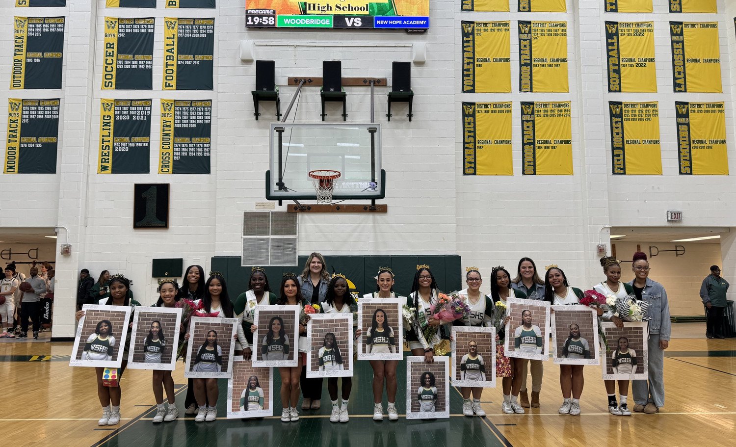 WSHS Cheerleaders in front of score board on Senior Night.