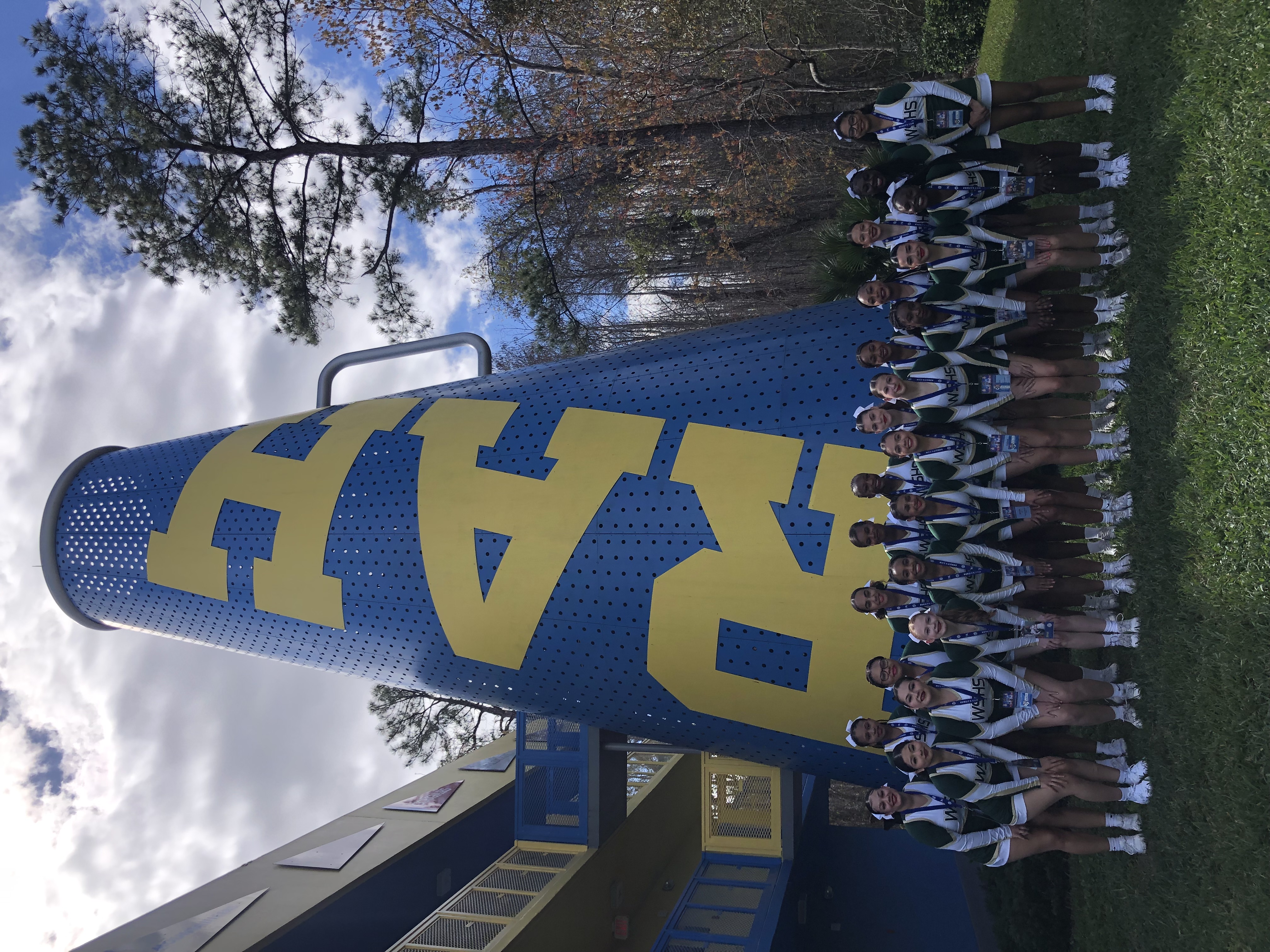 Cheerleading team in front of large bullhorn at nationals