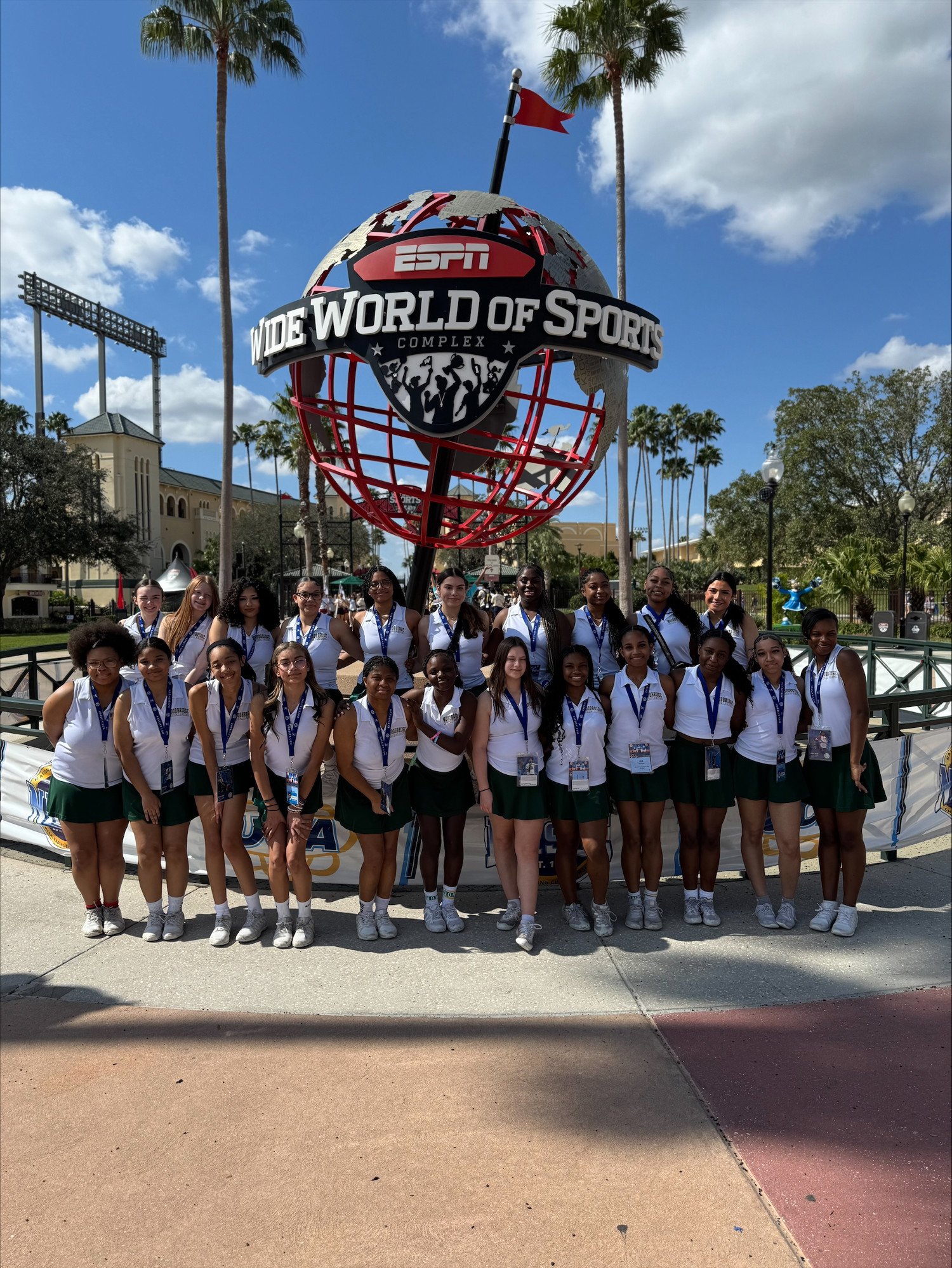 WSHS Cheerleaders in front of ESPN World of Sports statue at the nationals competition in Orlando Florida.