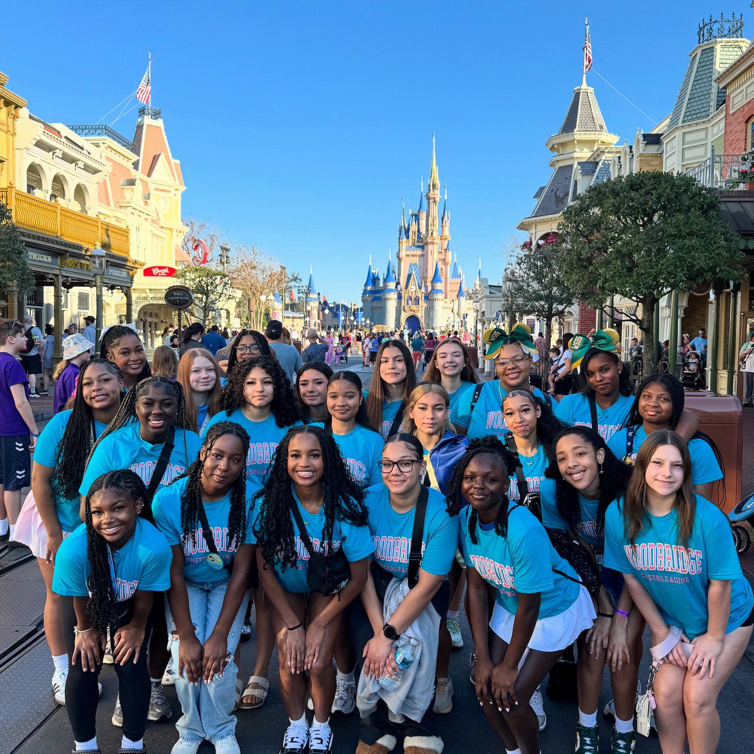 WSHS Cheerleaders posing on Main Street in Magic Kingdom at Disney World in Florida with Cinderella's Castle in the background. 
